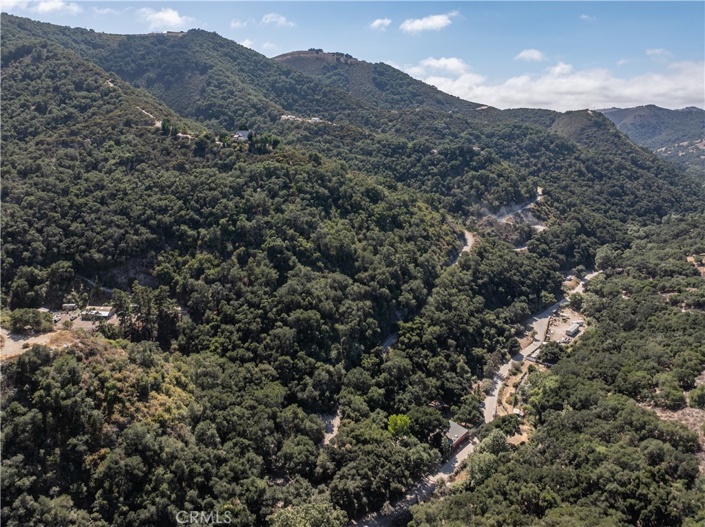 1010-1012 Upper Los Berros Road Nipomo, CA 93444 - Photo 52 of 75 a view of a dry yard with mountains in the background