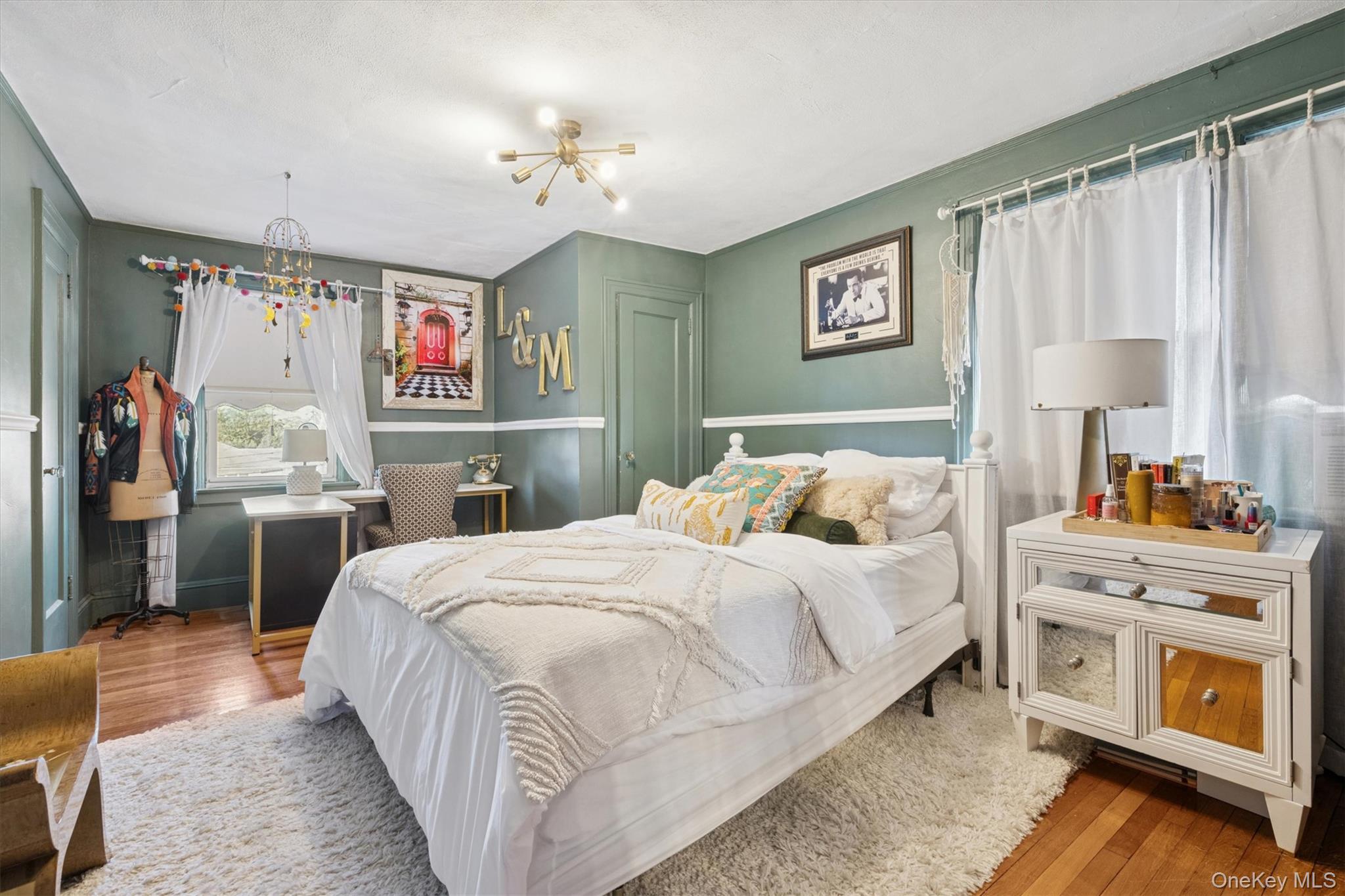 52-11 Redfield Street Queens, NY 11362 - Photo 19 of 32 Bedroom with a chandelier and wood finished floors
