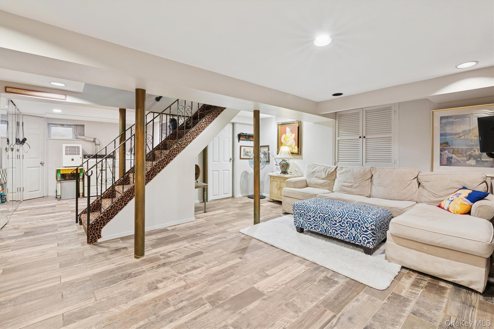 52-11 Redfield Street Queens, NY 11362 - Photo 25 of 32 Living area featuring recessed lighting, wood finished floors, and stairway