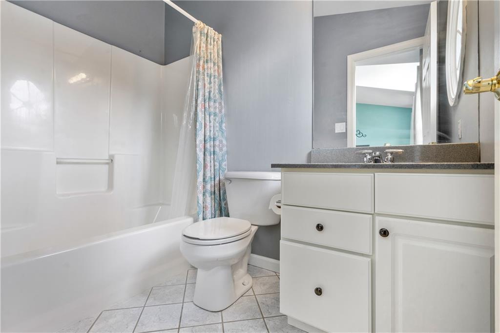 122 Terra Drive McKees Rocks, PA 15136 - Photo 19 of 28 a bathroom with a sink a toilet and mirror