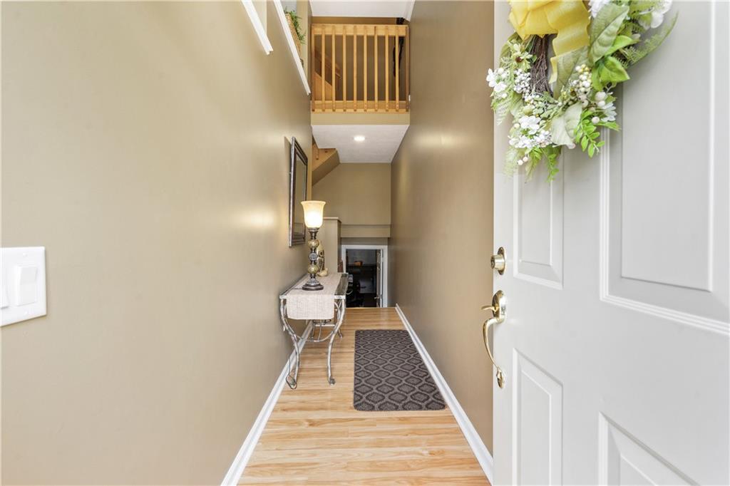 122 Terra Drive McKees Rocks, PA 15136 - Photo 24 of 28 a view of a hallway with wooden floor and staircase