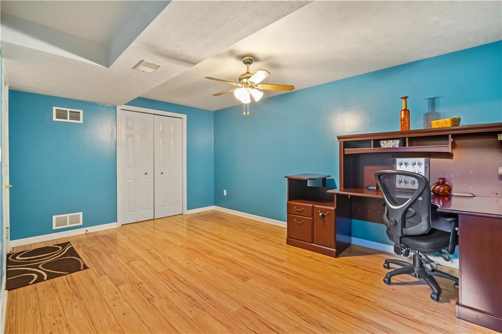 122 Terra Drive McKees Rocks, PA 15136 - Photo 25 of 28 a bedroom with a bed and a chandelier