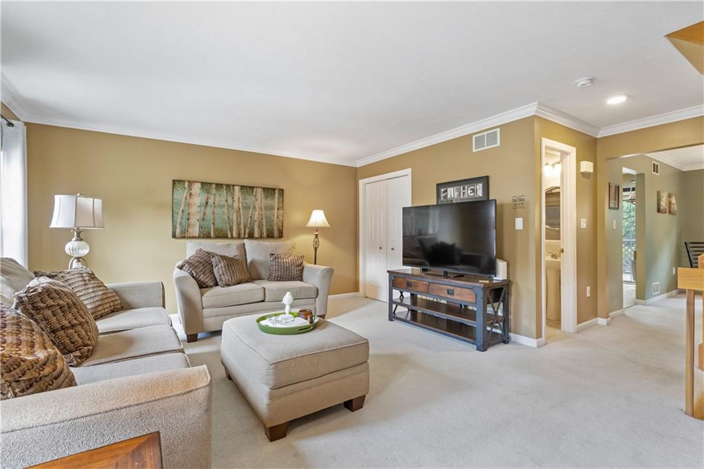 122 Terra Drive McKees Rocks, PA 15136 - Photo 4 of 28 a living room with furniture and a flat screen tv