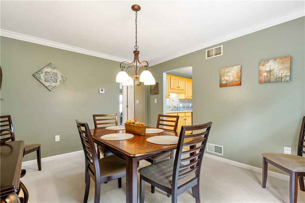 122 Terra Drive McKees Rocks, PA 15136 - Photo 7 of 28 a view of a dining room with a table and chairs