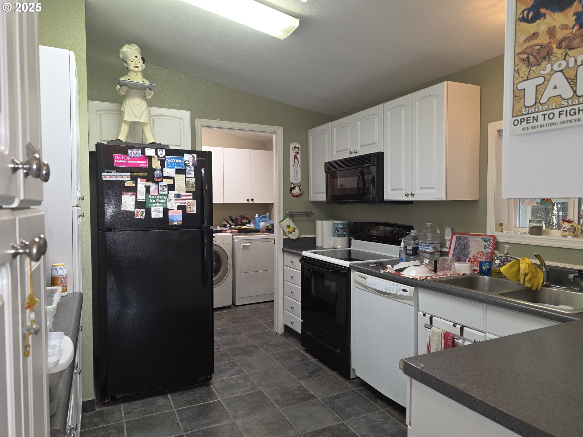 4808 Southeast 134th Drive Portland, OR 97236 - Photo 11 of 15 a kitchen with a refrigerator and a stove top oven