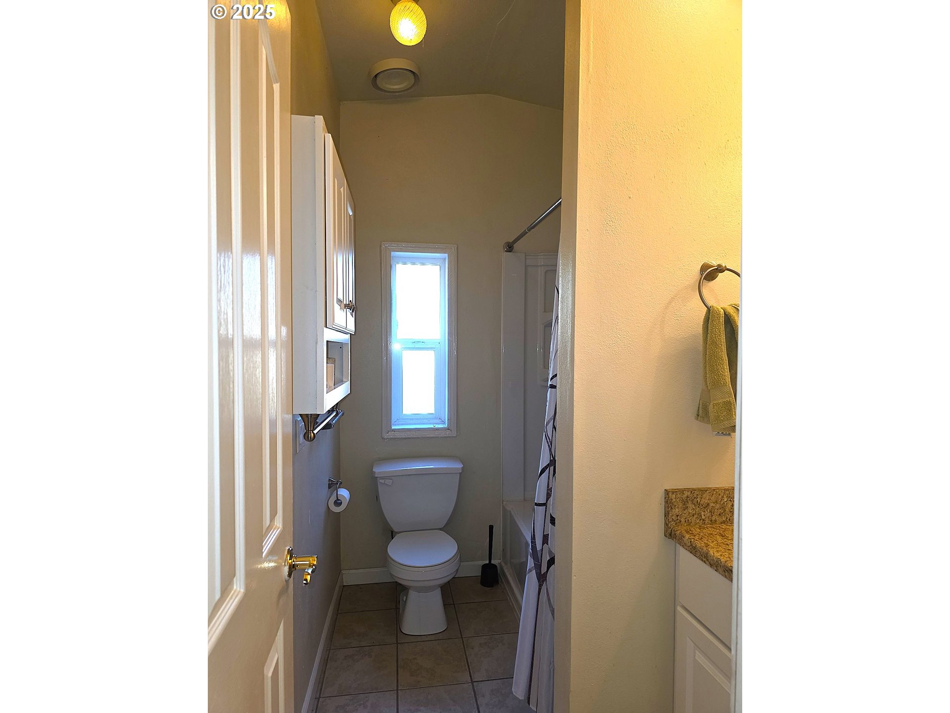 4808 Southeast 134th Drive Portland, OR 97236 - Photo 13 of 15 a bathroom with a toilet and a shower