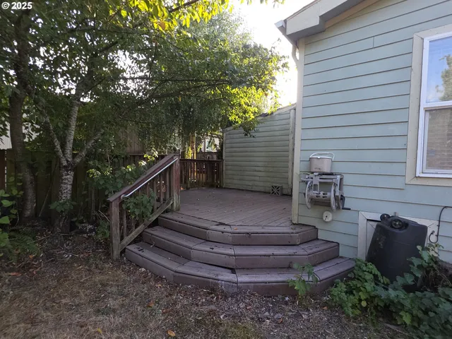 a kitchen with granite countertop a stove sink and cabinets