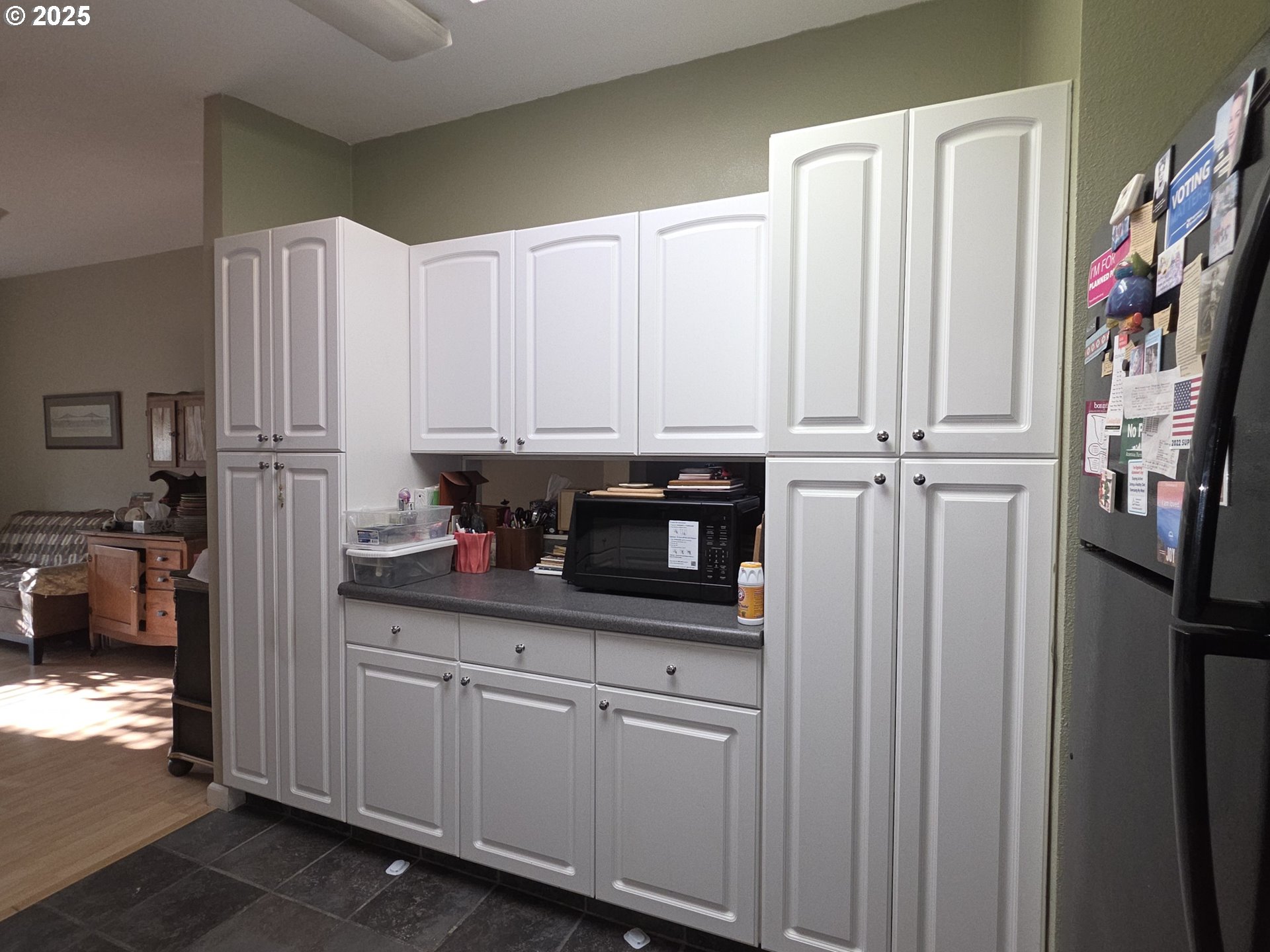 4808 Southeast 134th Drive Portland, OR 97236 - Photo 7 of 15 a kitchen with stainless steel appliances a refrigerator and cabinets