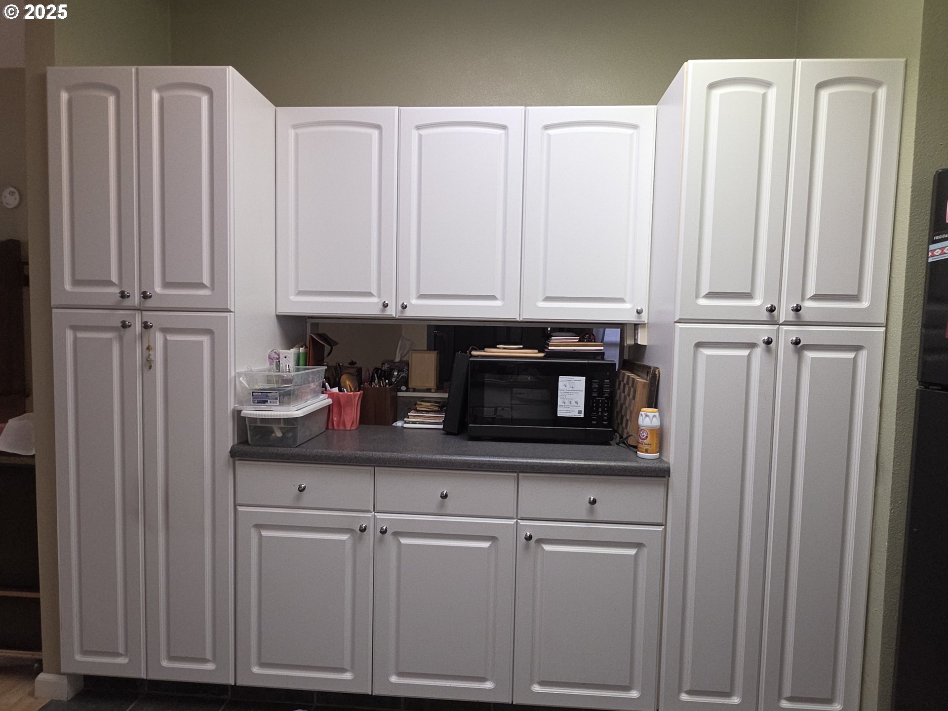 4808 Southeast 134th Drive Portland, OR 97236 - Photo 9 of 15 a kitchen with stainless steel appliances white cabinets and a sink