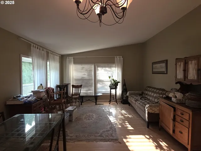 a kitchen with a refrigerator and a stove top oven