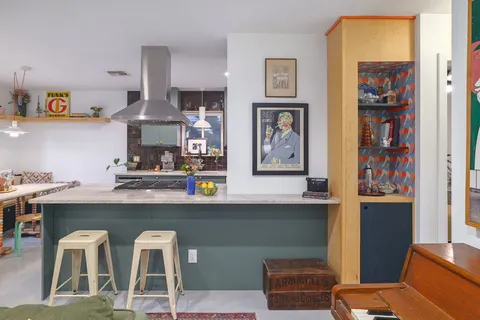 a dining room with furniture and window