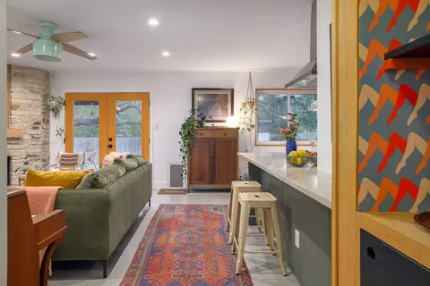 a living room with furniture and a window