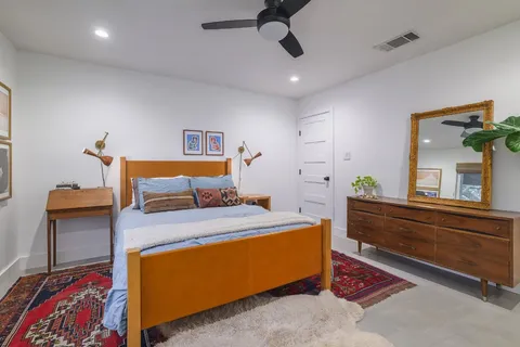 a bed room with a bed and a chandelier