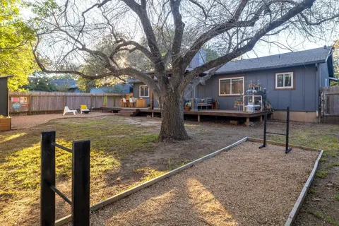 a view of a house with backyard porch and sitting area