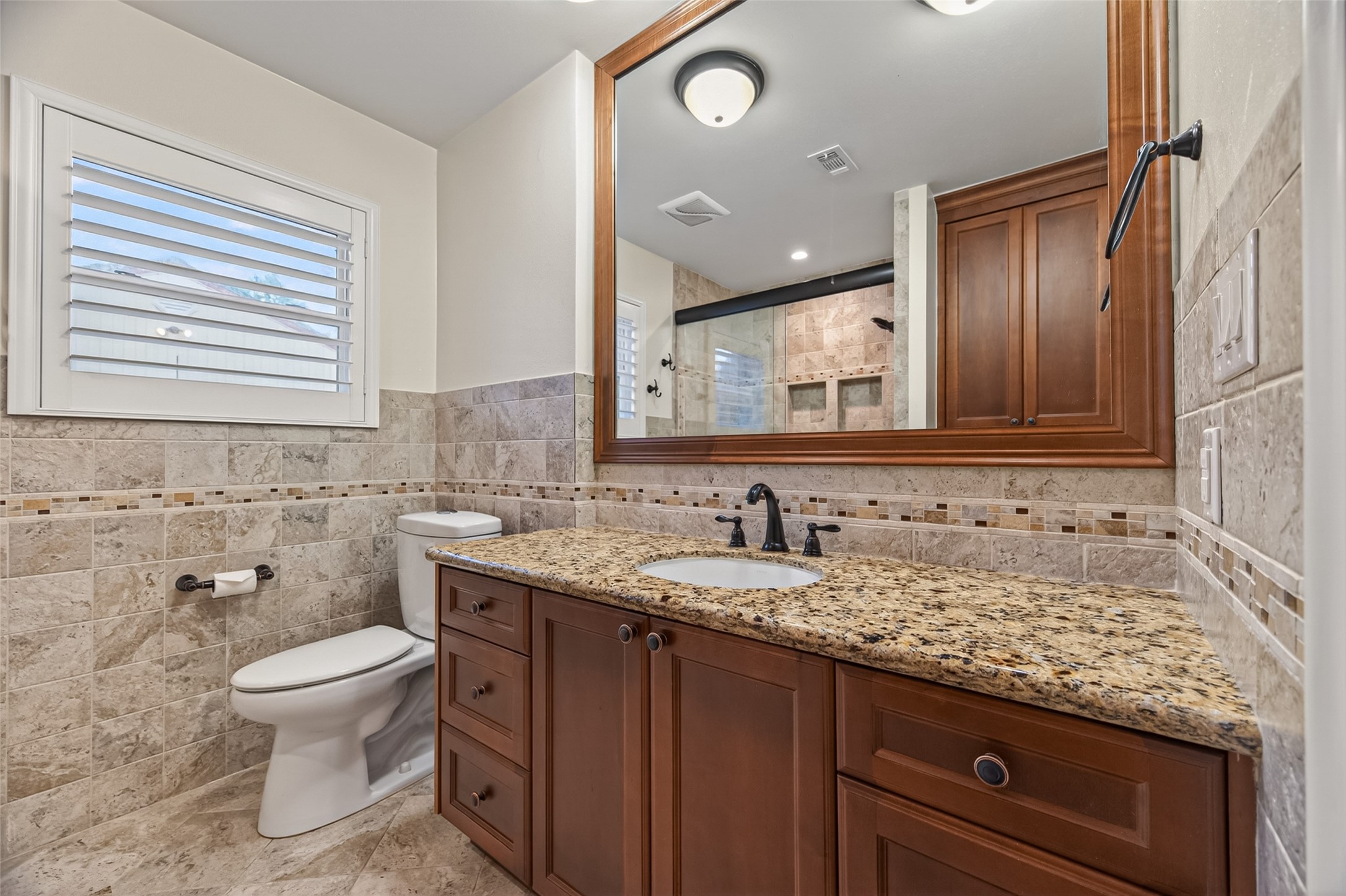 5638 Sanford Road Houston, TX 77096 - Photo 21 of 41 Secondary bathroom remodel thoughtfully designed with accessibility in mind.