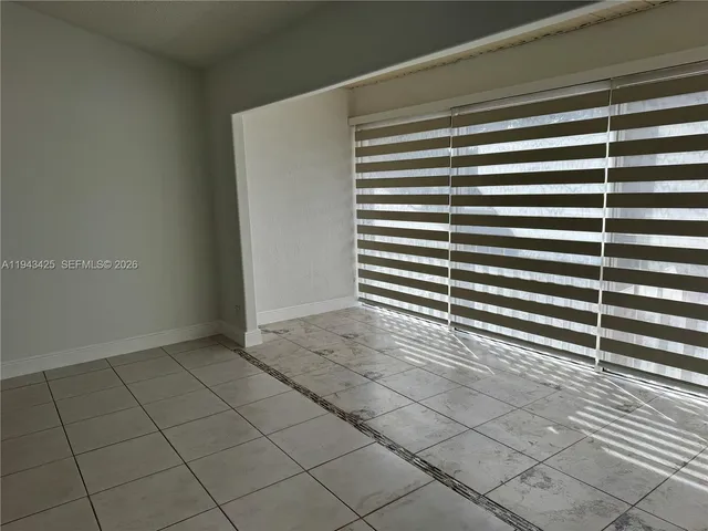 a view of a room that has a window in it