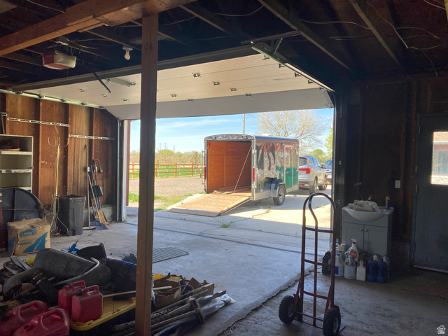 200 South 2800th Street West Ogden, UT 84404 - Photo 23 of 42 Miscellaneous room with unfinished concrete floors and a garage