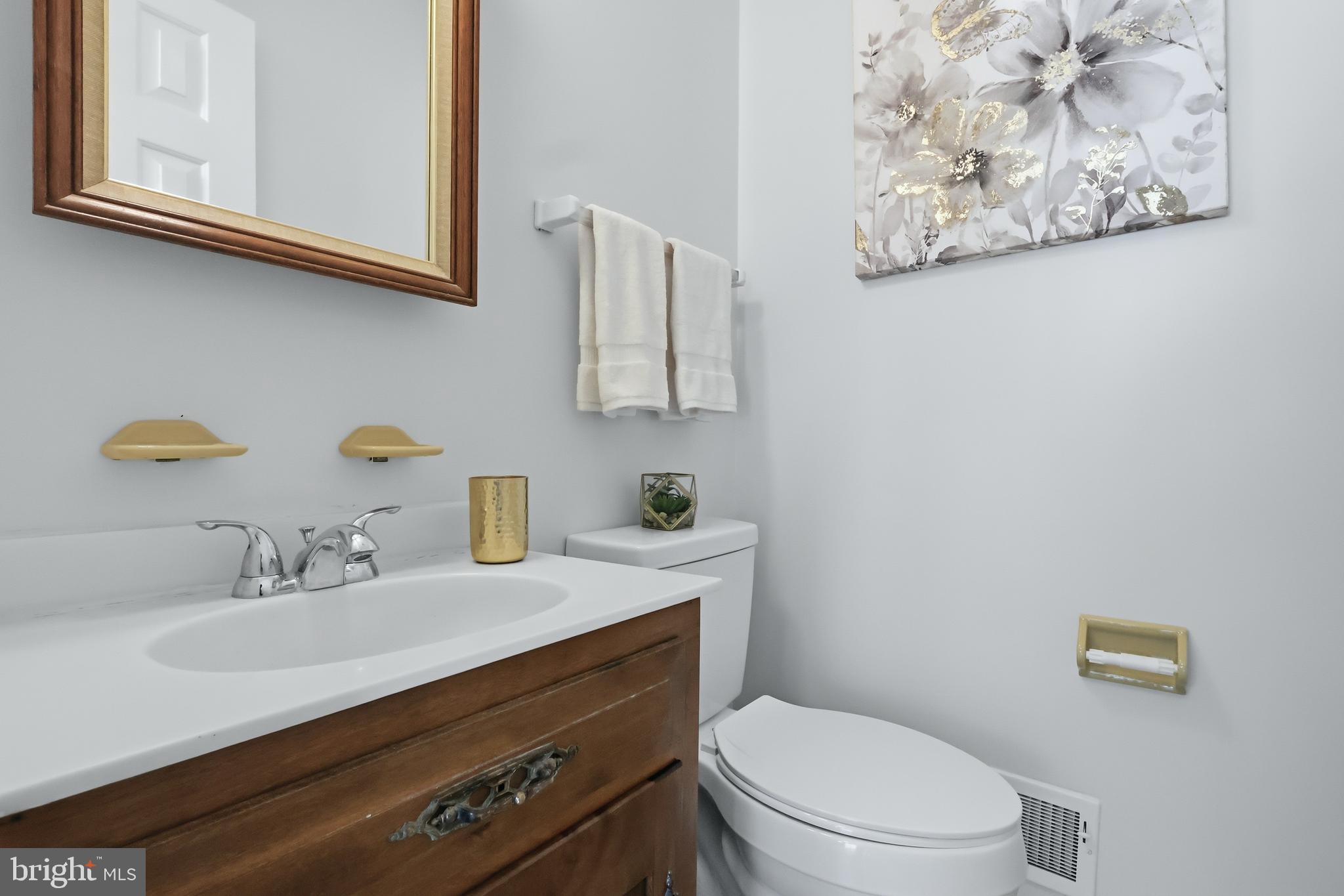 23500 River Road Lexington Park, MD 20653 - Photo 38 of 92 a bathroom with a sink mirror vanity and toilet