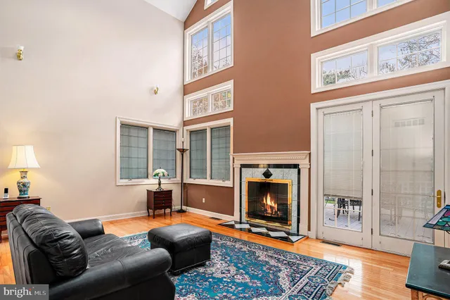 a kitchen with kitchen island granite countertop a sink cabinets and stainless steel appliances