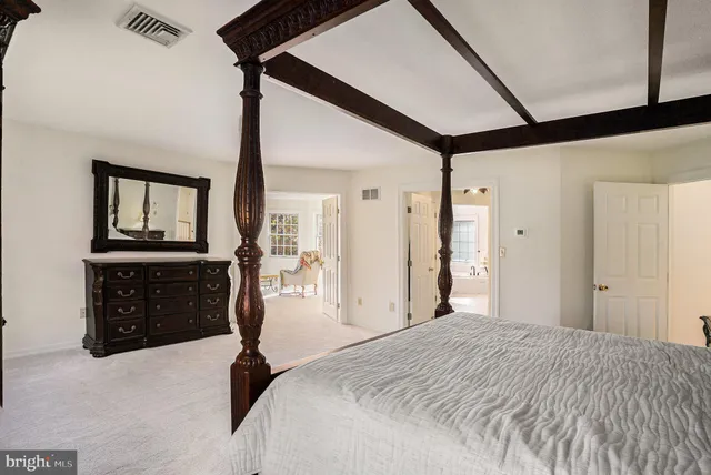 a bathroom with a bathtub sink and mirror