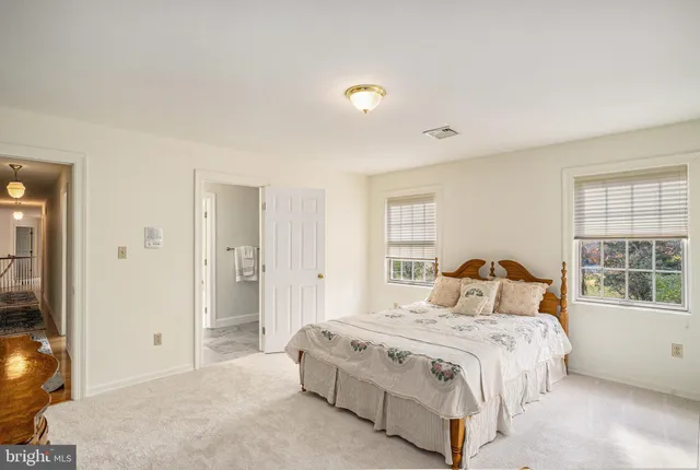 a bedroom with a bed and a cabinets