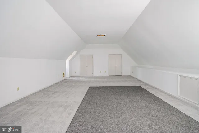 a view of a patio with table and chairs and wooden floor