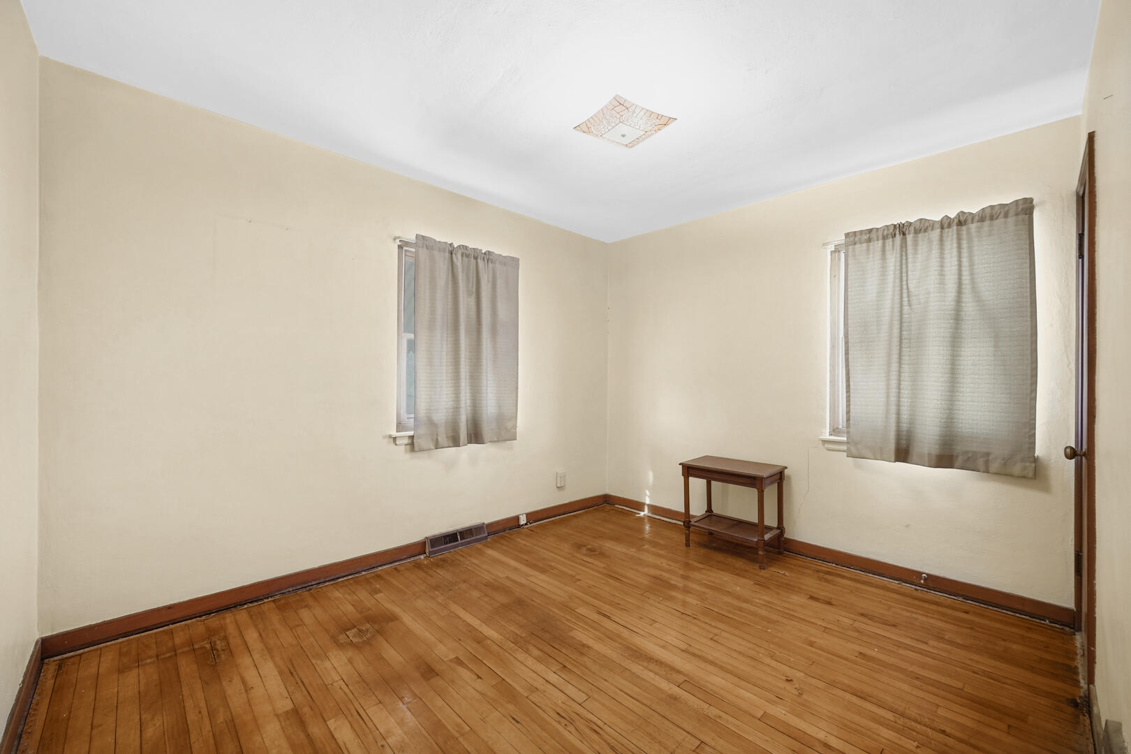 5405 Birch Avenue Hammond, IN 46320 - Photo 8 of 20 a view of an empty room with wooden floor and a window