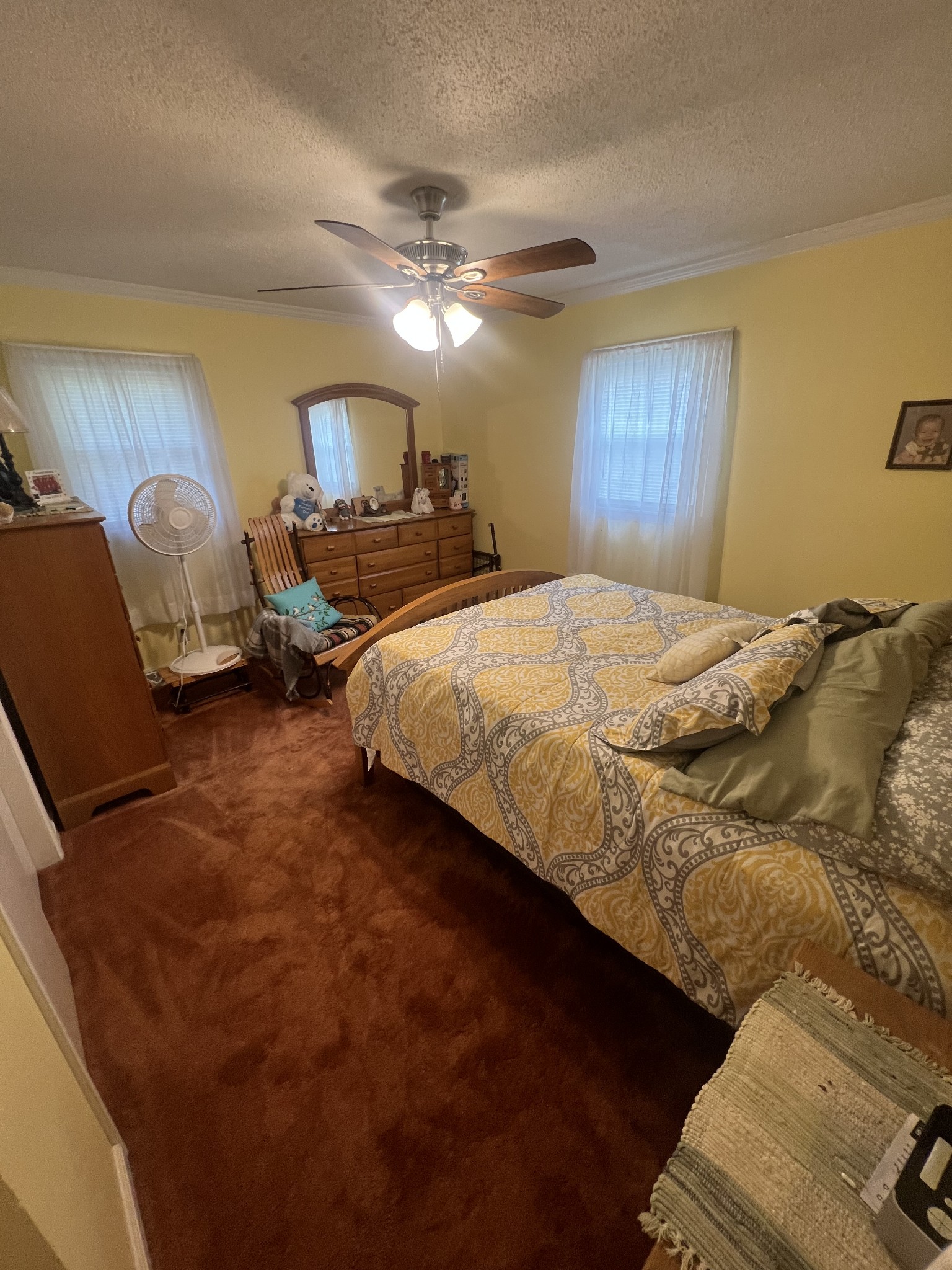105 Tollgate Road Pulaski, TN 38478 - Photo 21 of 38 a bedroom with a bed and a chandelier
