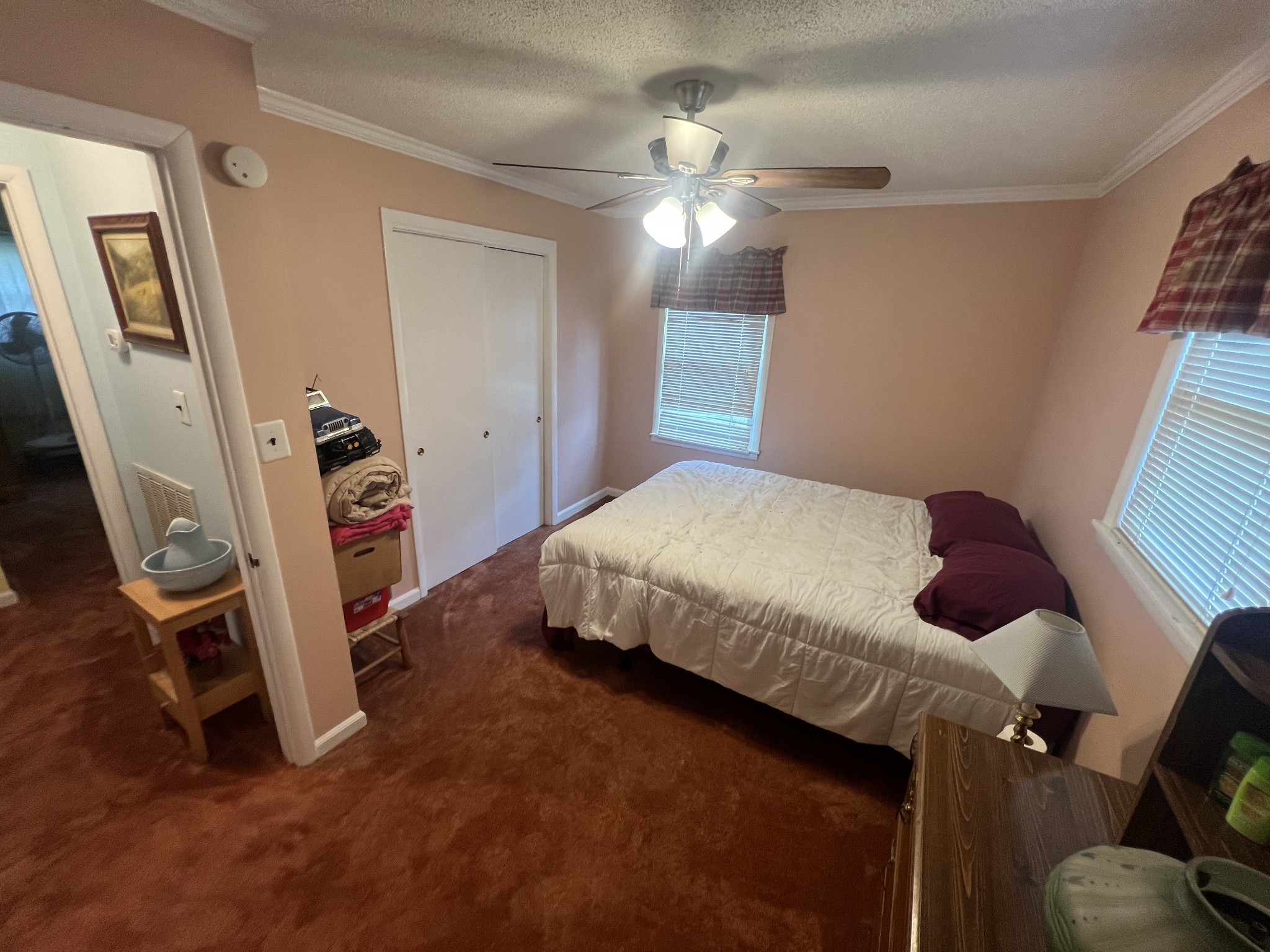 105 Tollgate Road Pulaski, TN 38478 - Photo 24 of 38 a bedroom with a bed and a mirror on the dresser