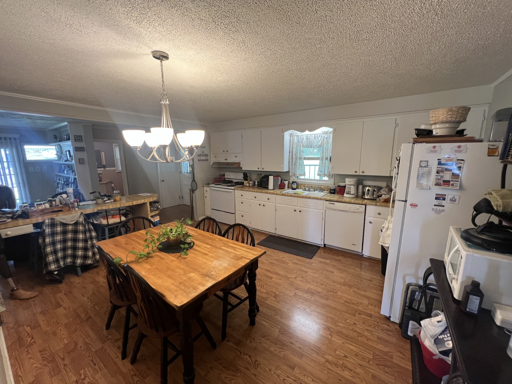 105 Tollgate Road Pulaski, TN 38478 - Photo 7 of 38 a kitchen with a dining table chairs sink and stove