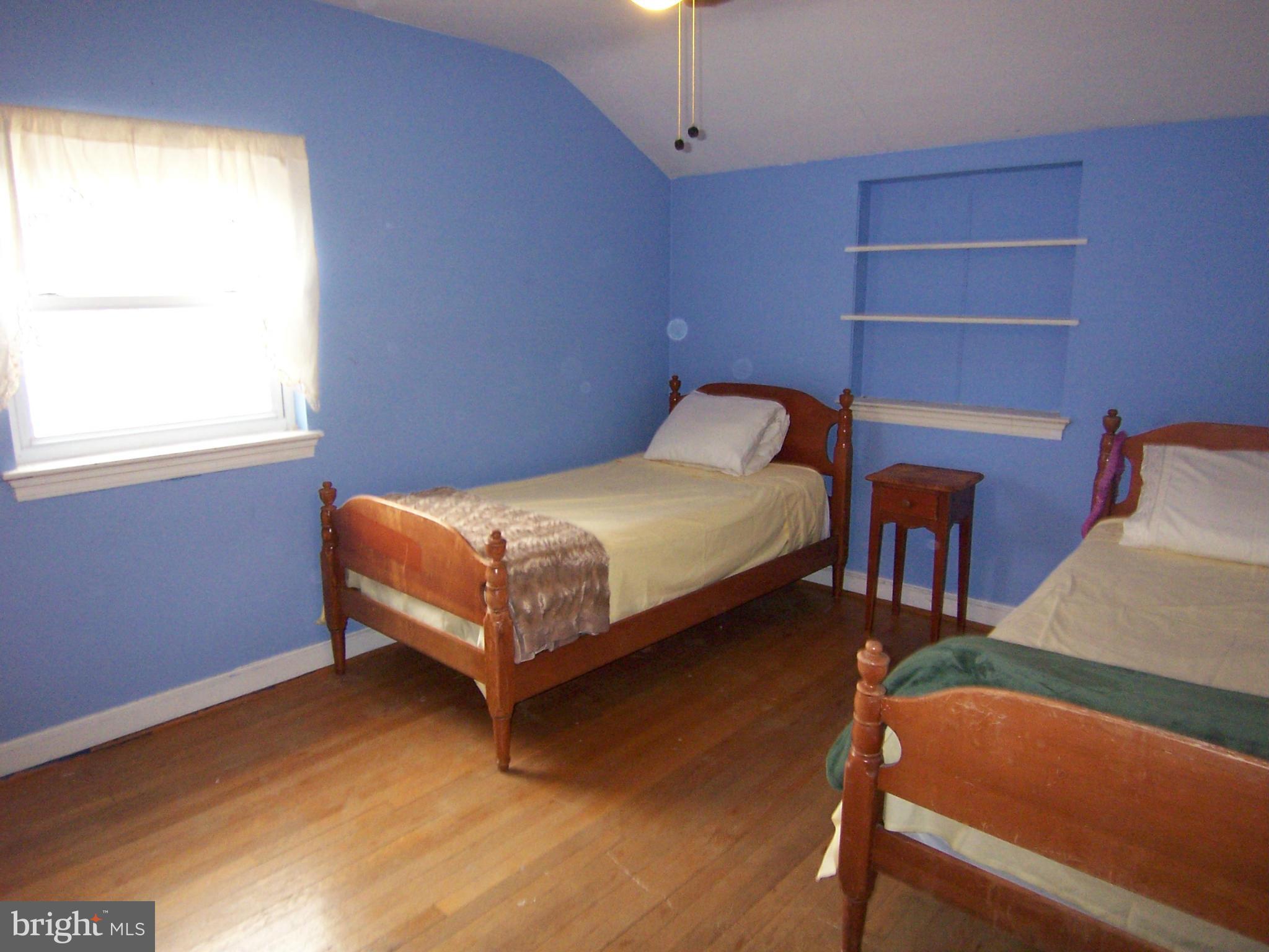 5322 Wakefield Road Bethesda, MD 20816 - Photo 12 of 14 a bedroom with a bed and window