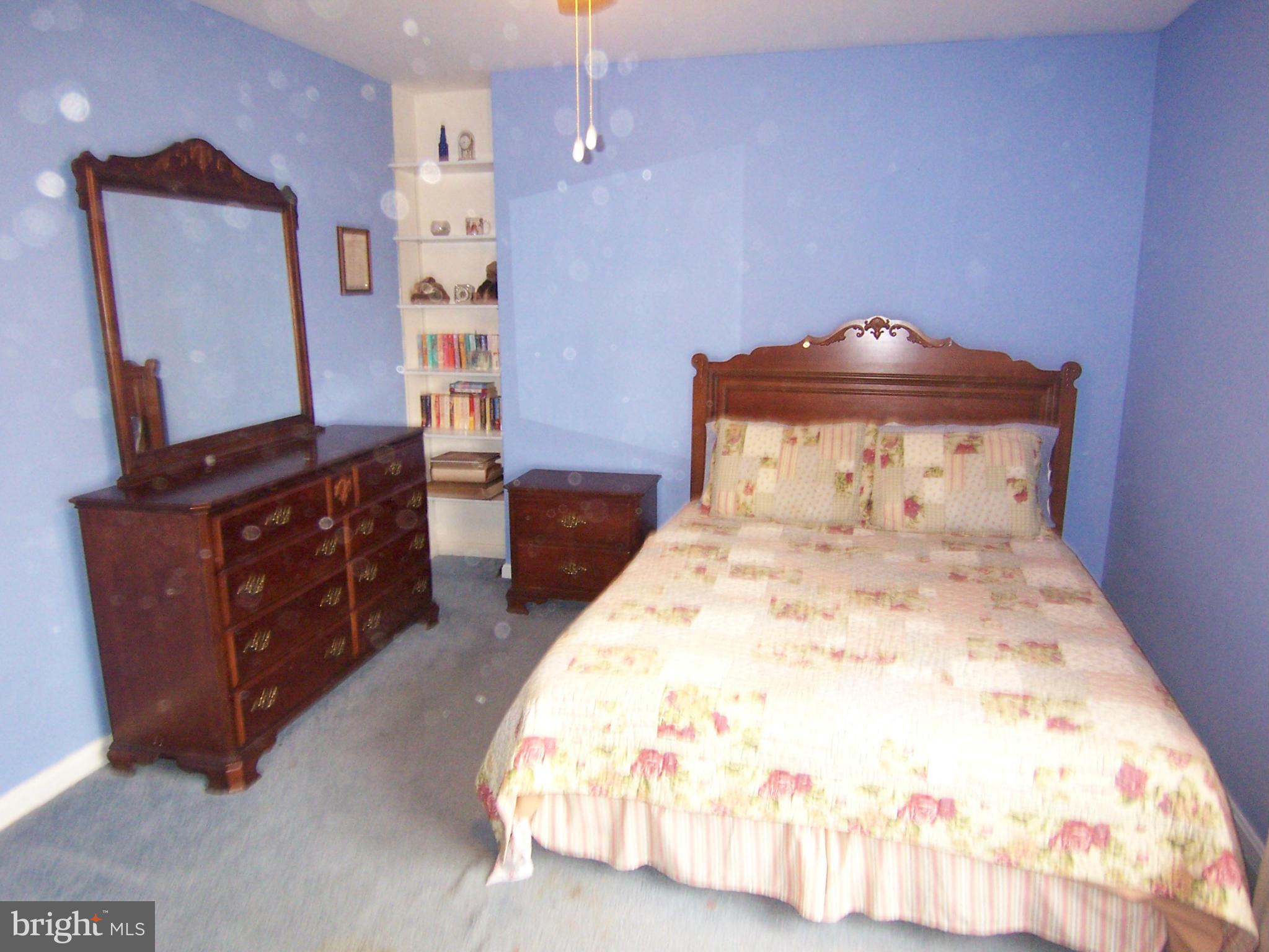 5322 Wakefield Road Bethesda, MD 20816 - Photo 13 of 14 a bedroom with a bed and a dresser