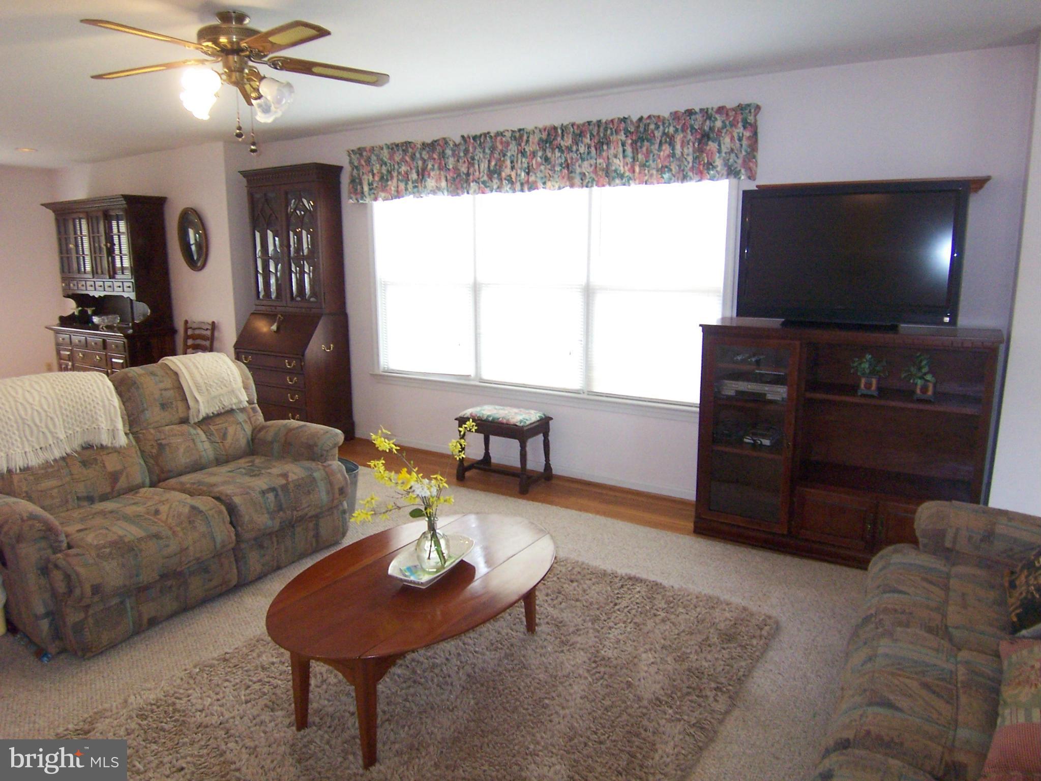 5322 Wakefield Road Bethesda, MD 20816 - Photo 3 of 14 a living room with furniture and a flat screen tv