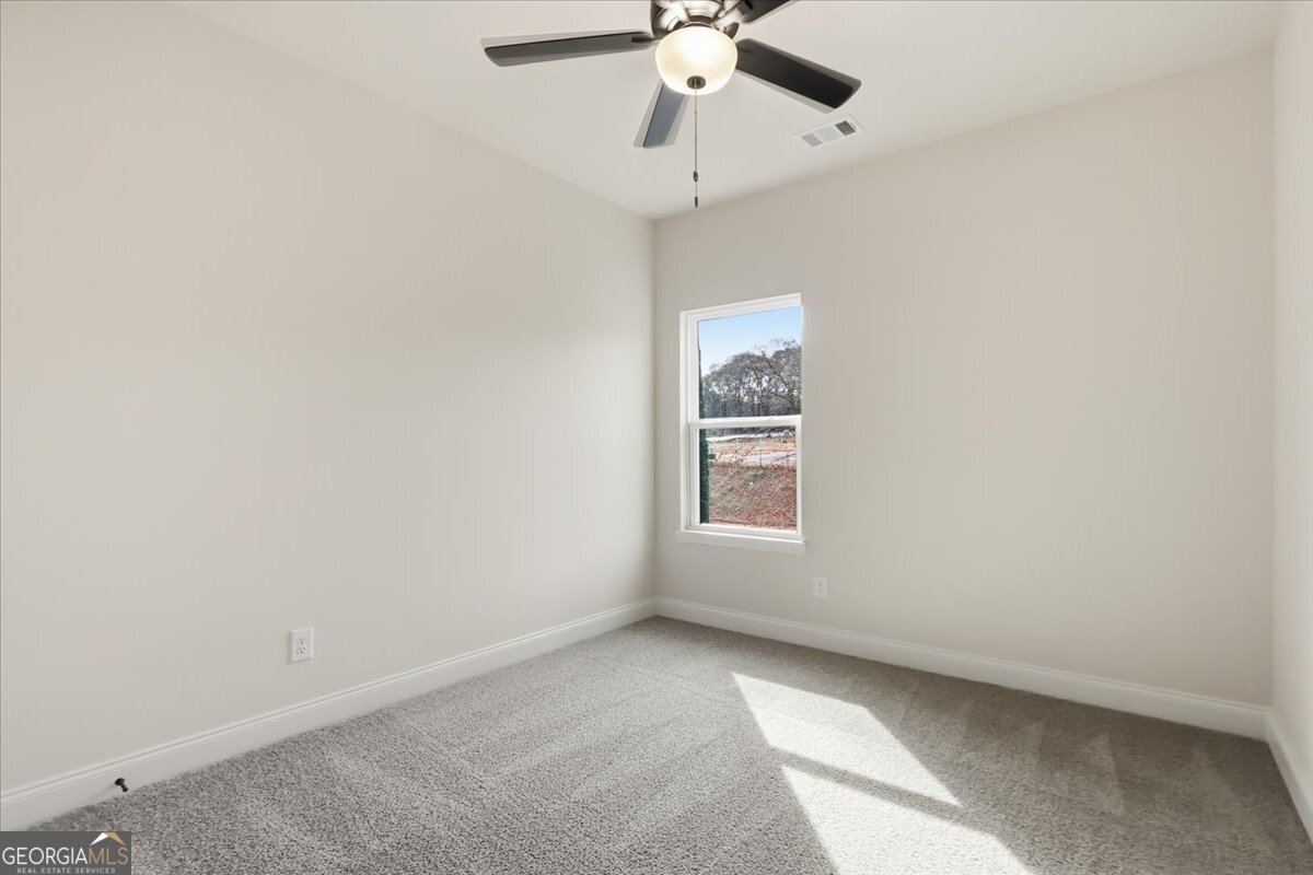 49 Wright Street, Unit 65 Lavonia, GA 30553 - Photo 23 of 57 an empty room with a window