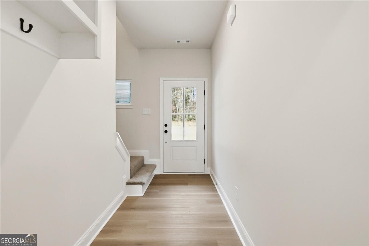 49 Wright Street, Unit 65 Lavonia, GA 30553 - Photo 5 of 57 a view of a hallway with wooden floor