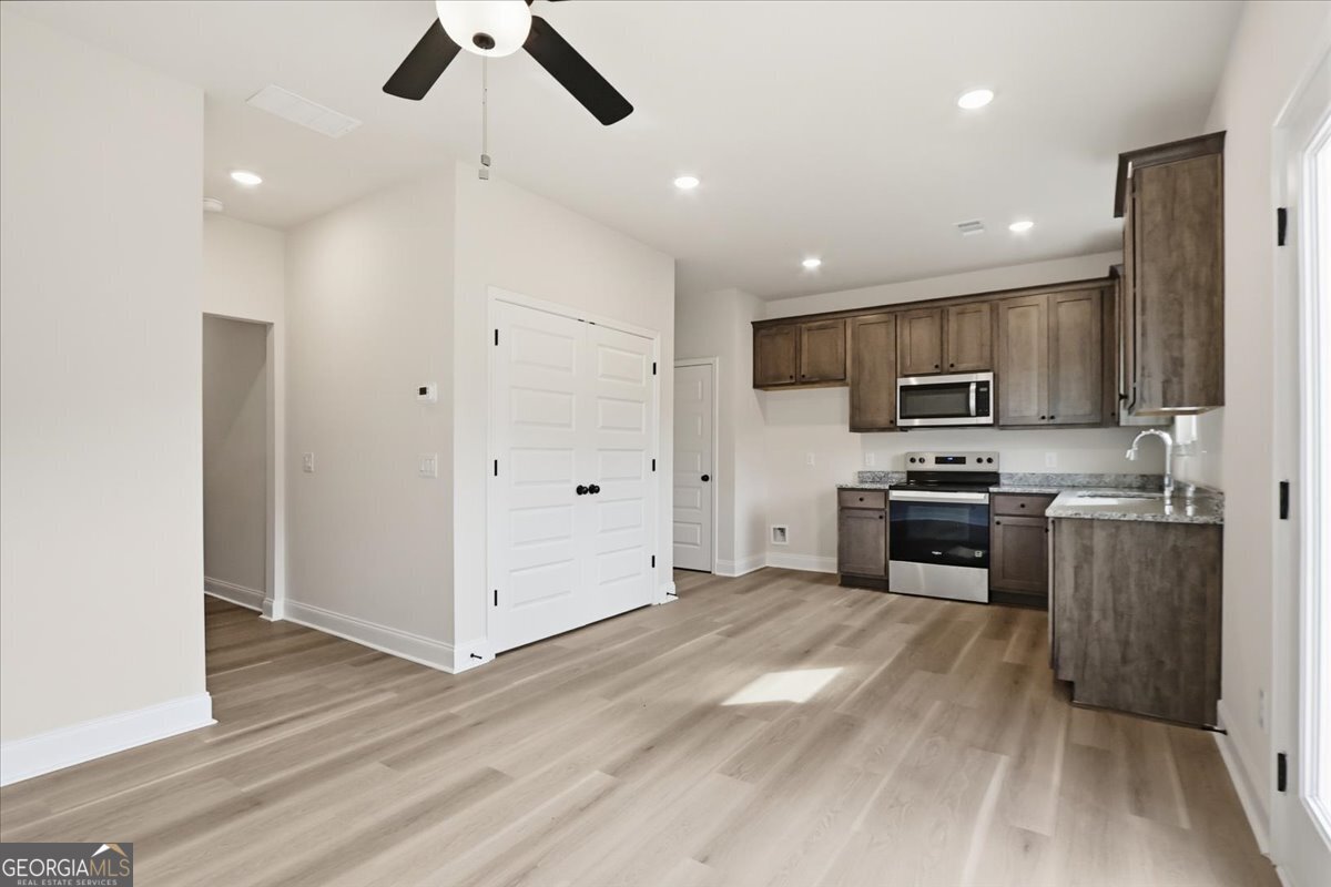 49 Wright Street, Unit 65 Lavonia, GA 30553 - Photo 10 of 57 a kitchen with stainless steel appliances granite countertop a refrigerator a stove top oven a sink and dishwasher