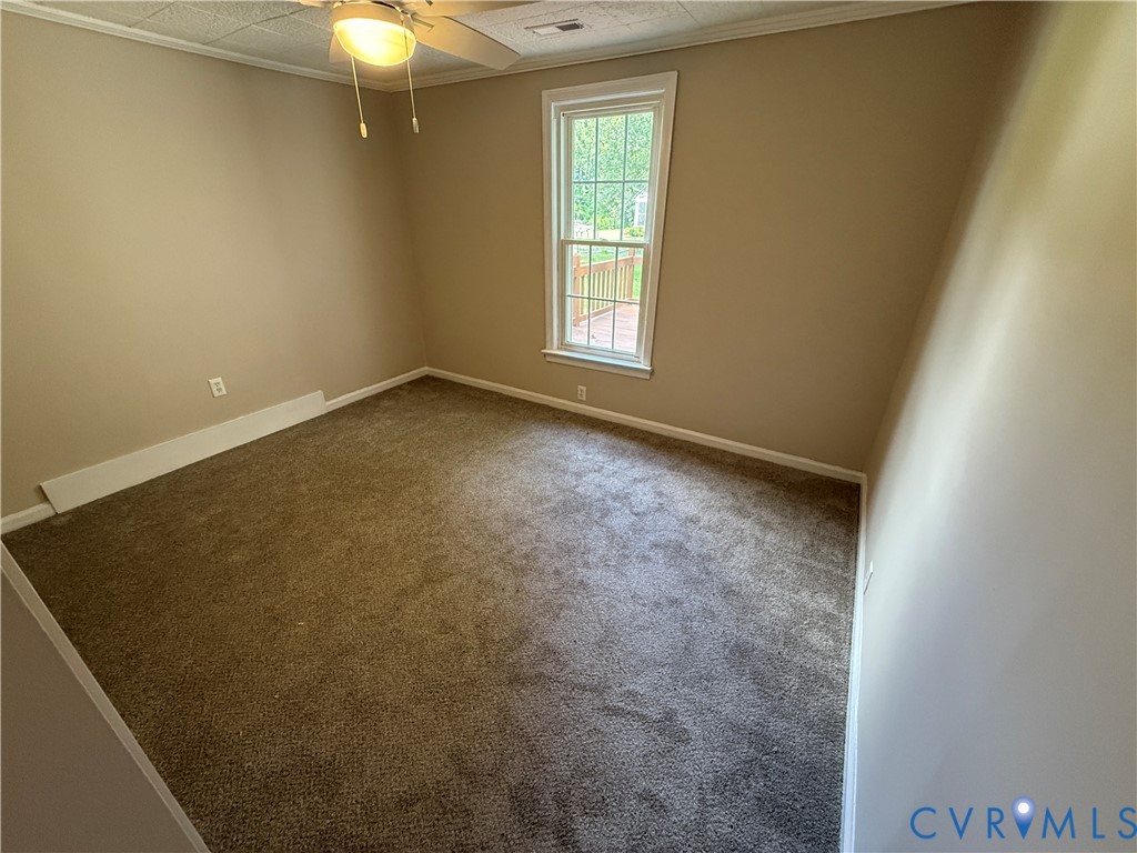 14807 Spruce Avenue Chester, VA 23836 - Photo 11 of 11 an empty room with windows