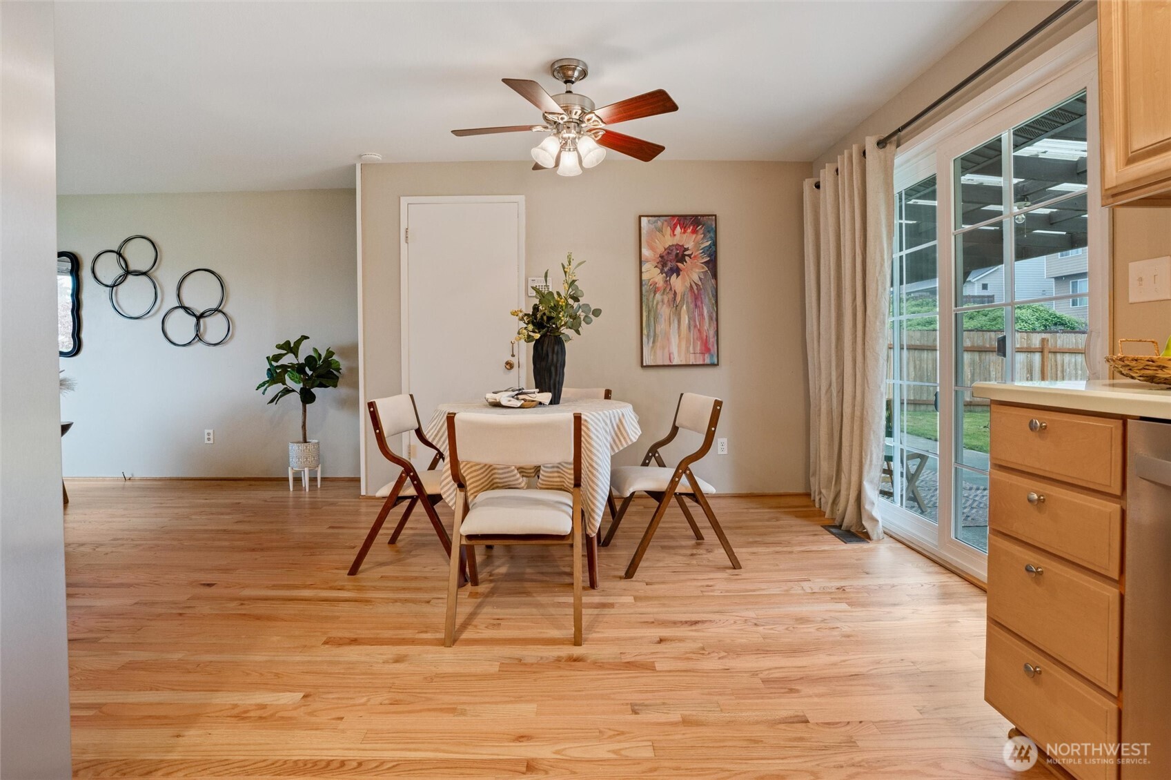 3876 Northeast Pinecone Drive Bremerton, WA 98310 - Photo 16 of 27 a view of a dining room with furniture and a potted plant