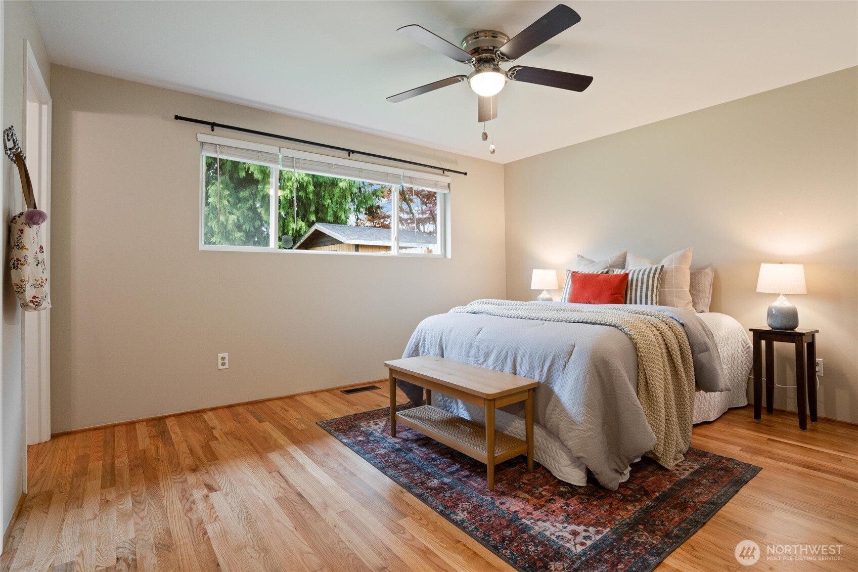 3876 Northeast Pinecone Drive Bremerton, WA 98310 - Photo 19 of 27 a spacious bedroom with a bed and a window