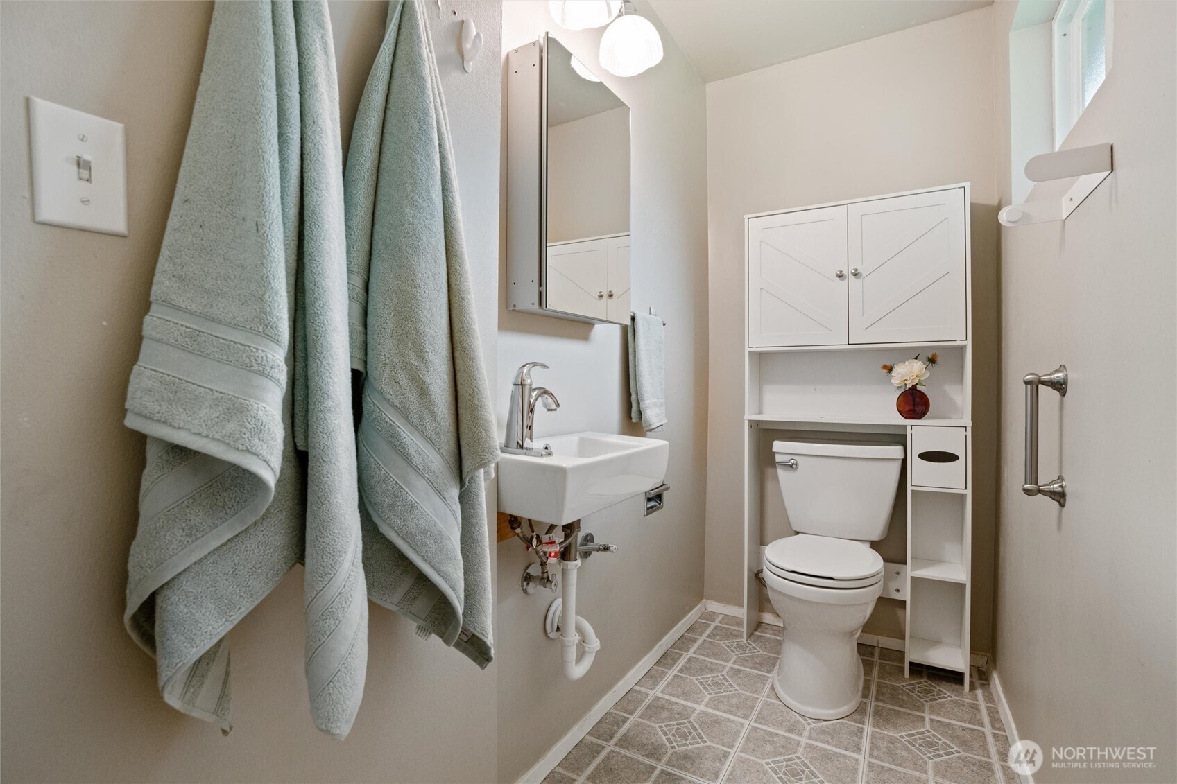 3876 Northeast Pinecone Drive Bremerton, WA 98310 - Photo 21 of 27 a bathroom with a granite countertop sink toilet and shower