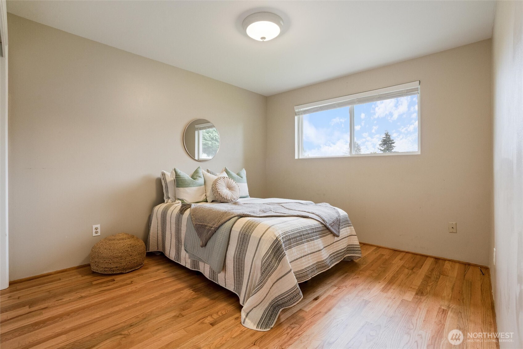 3876 Northeast Pinecone Drive Bremerton, WA 98310 - Photo 22 of 27 a bedroom with a bed and a window