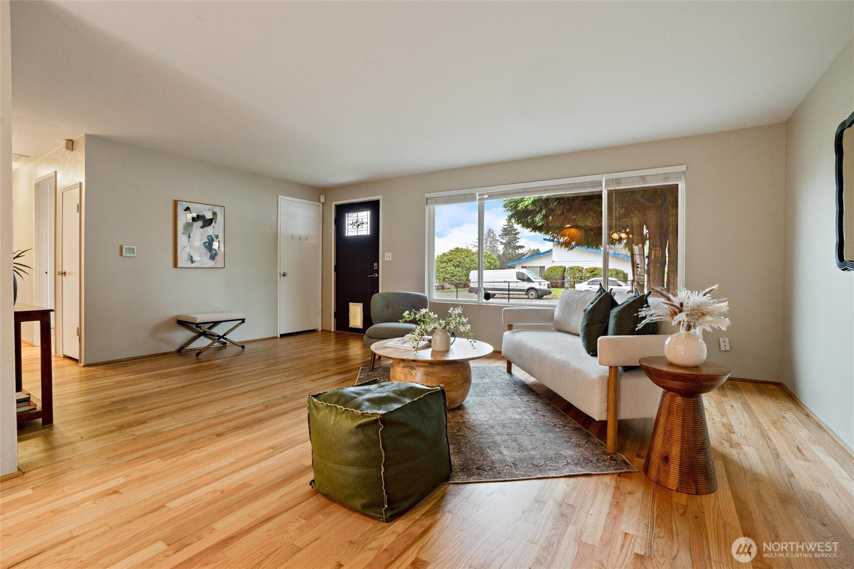 3876 Northeast Pinecone Drive Bremerton, WA 98310 - Photo 7 of 27 a living room with fireplace furniture and a wooden floor