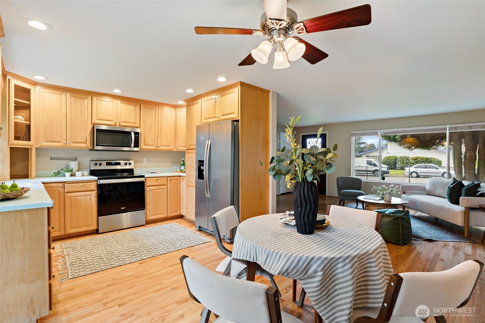 3876 Northeast Pinecone Drive Bremerton, WA 98310 - Photo 10 of 27 a kitchen with granite countertop lots of counter top space and stainless steel appliances