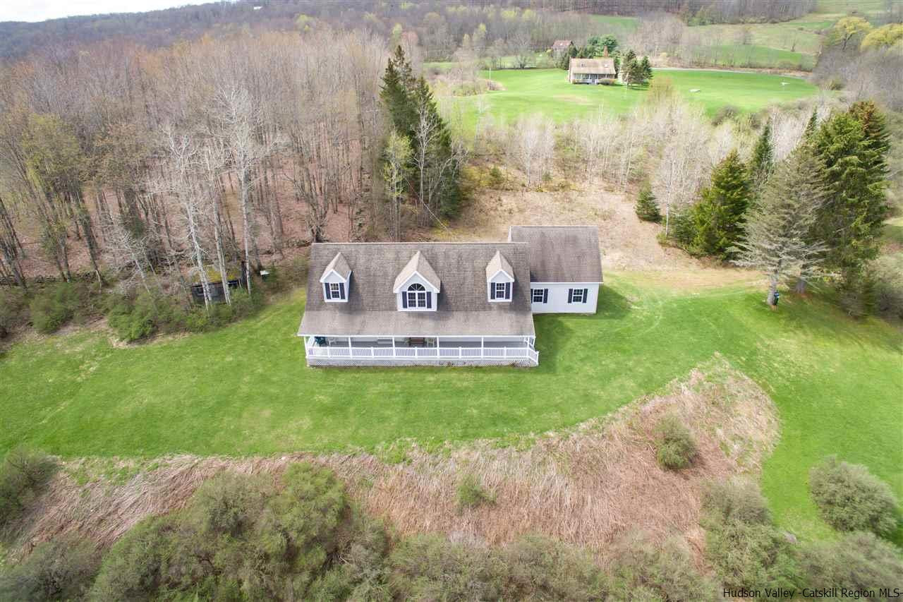 548 Carroll Hinkley Road Roxbury, NY 12474 - Photo 15 of 35 a view of a lake with a garden