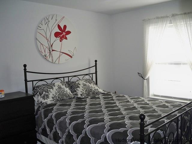 548 Carroll Hinkley Road Roxbury, NY 12474 - Photo 21 of 35 a bedroom with a bed and a window