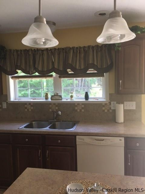 548 Carroll Hinkley Road Roxbury, NY 12474 - Photo 22 of 35 a kitchen with granite countertop a sink and a wooden cabinets
