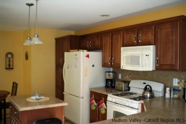 548 Carroll Hinkley Road Roxbury, NY 12474 - Photo 5 of 35 a kitchen with refrigerator and cabinets