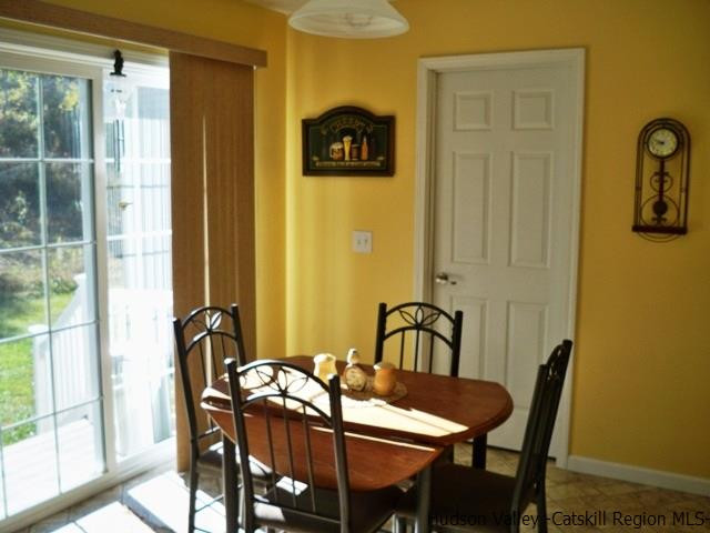 548 Carroll Hinkley Road Roxbury, NY 12474 - Photo 6 of 35 a view of a dining room with furniture and window