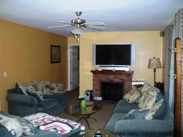 548 Carroll Hinkley Road Roxbury, NY 12474 - Photo 10 of 35 a living room with furniture and a flat screen tv