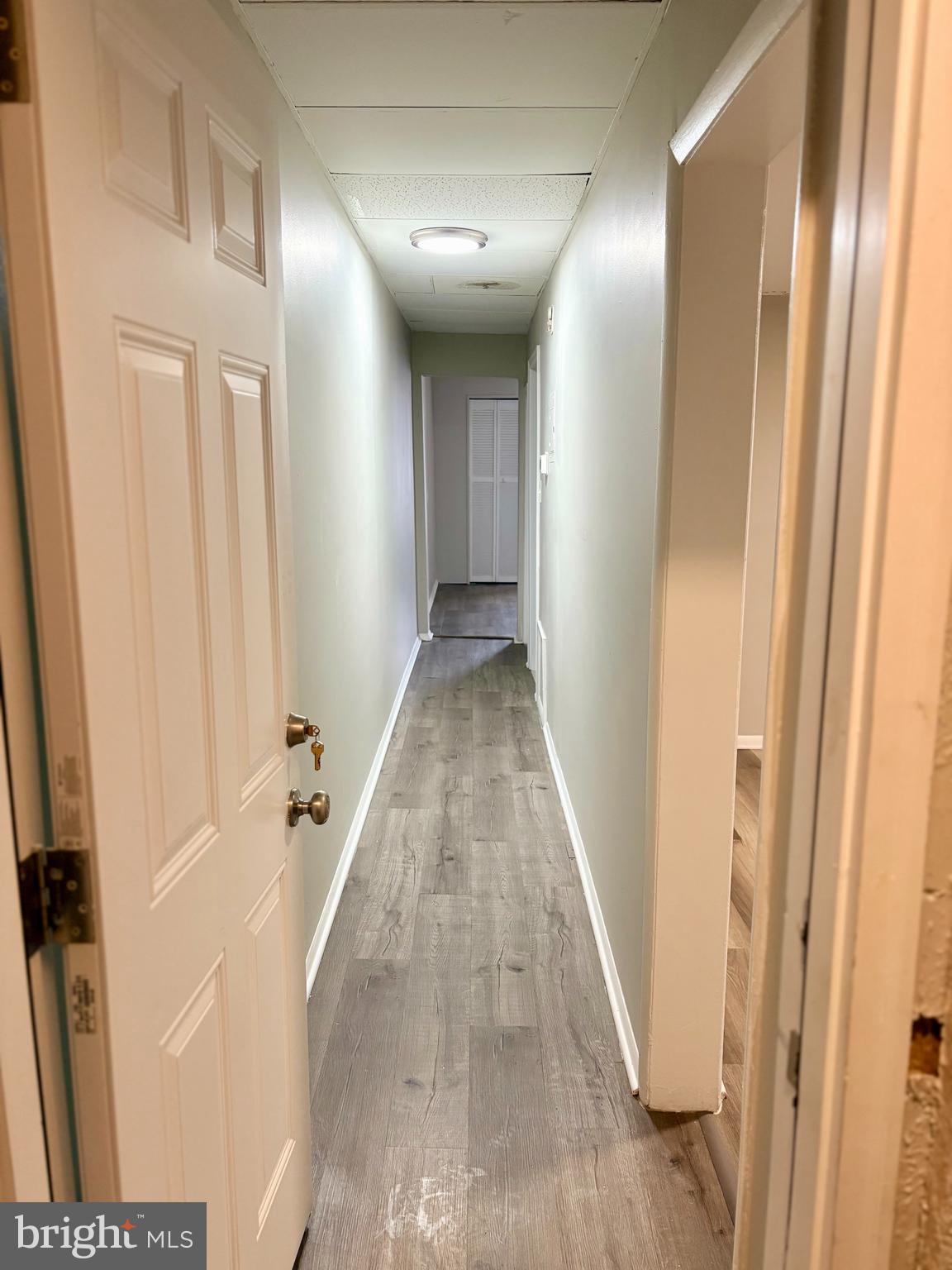 244 North Fulton Avenue, Unit 2 Baltimore, MD 21223 - Photo 2 of 14 Front door entrance / Hallway to Kitchen + Bath